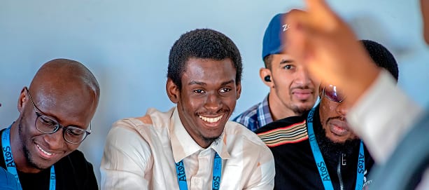 Learners smiling during a group discussion