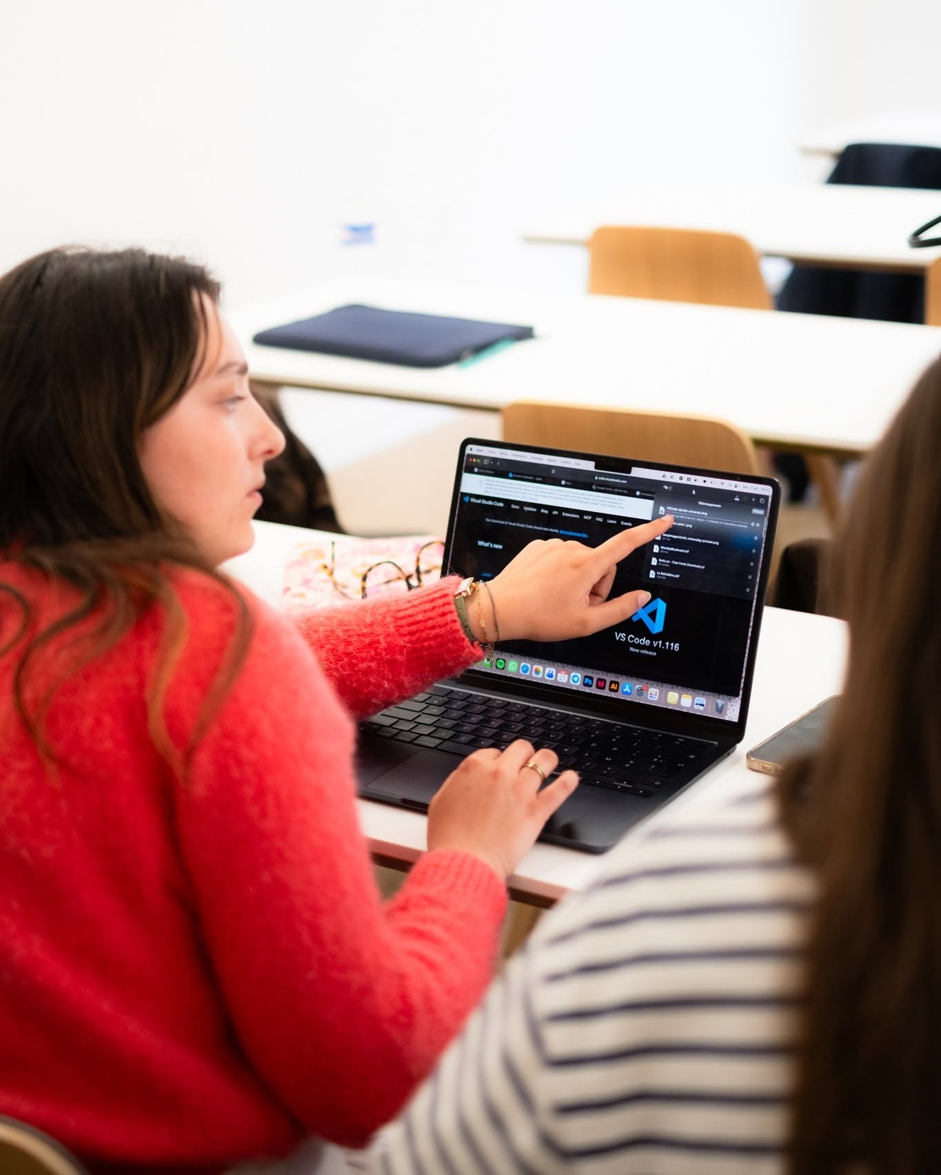 Learners working at desktop computers in a training lab